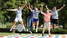 Students having fun with inflatable twister game